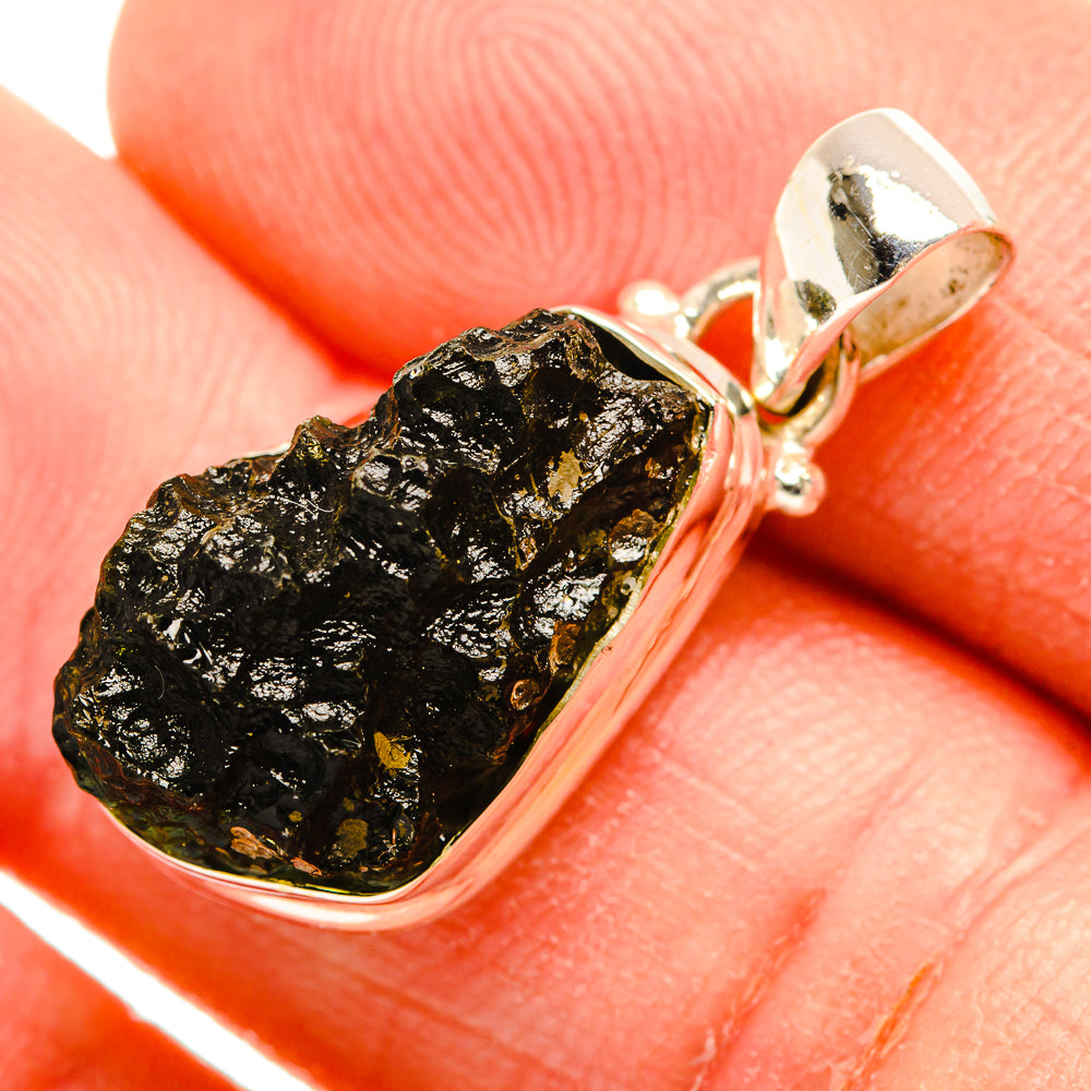 Sterling silver bezel pendant with rough dark green moldavite crystal and bail