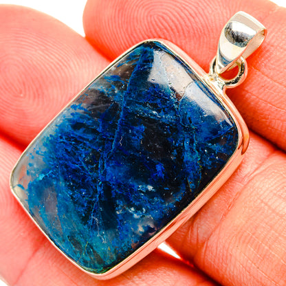 Apatite gemstone pendant with silver bezel and bail, blue stone close-up