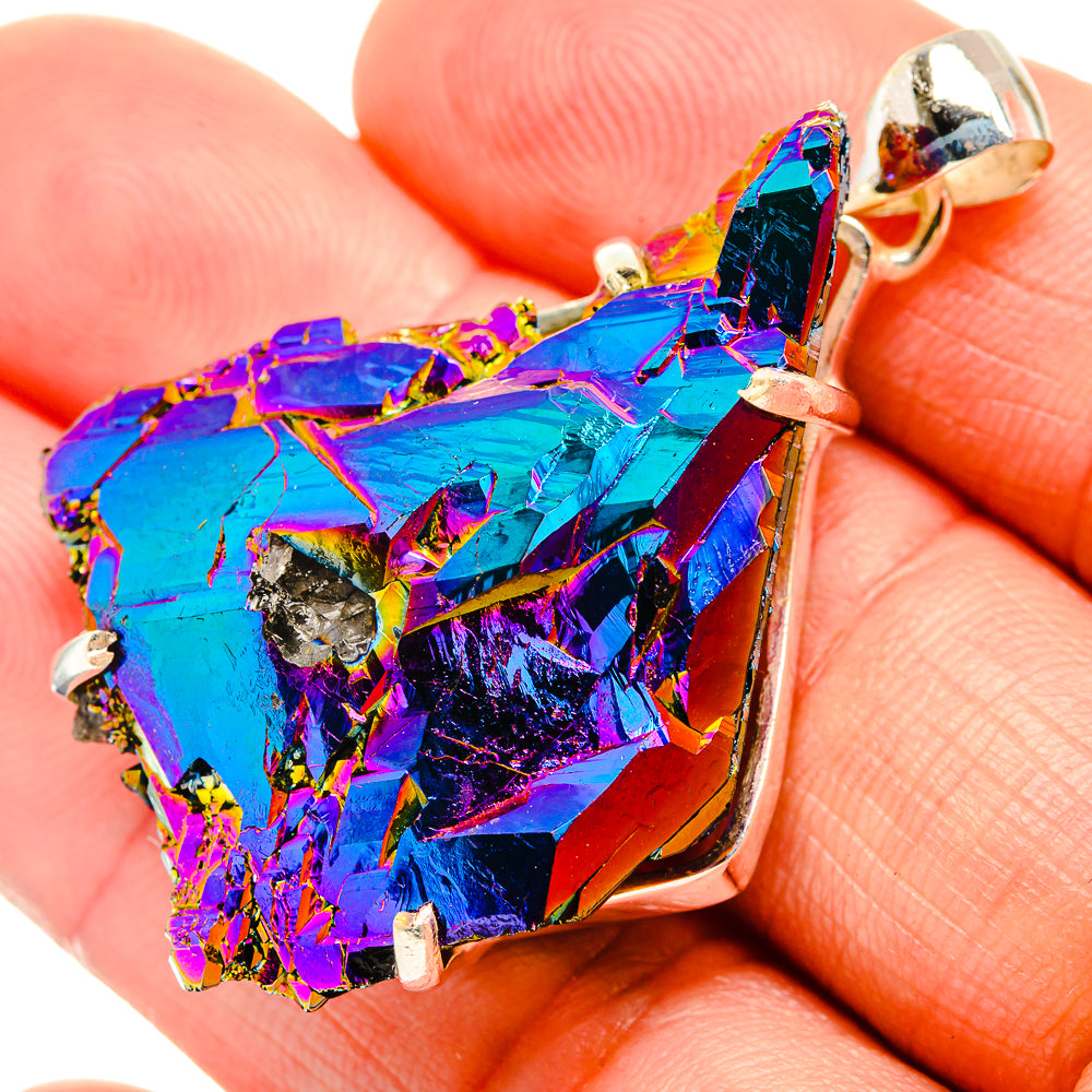 Close-up drusy pendant charm in rainbow blue and purple with silver bail and prongs