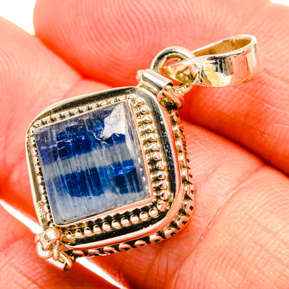 Blue kyanite pendant closeup in square sterling silver bezel with bail and accents