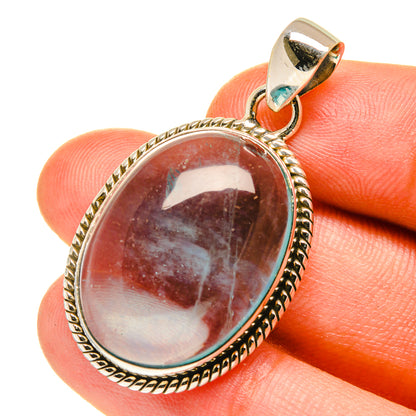 Oval red-brown fluorite pendant in 925 sterling silver bezel with loop bail