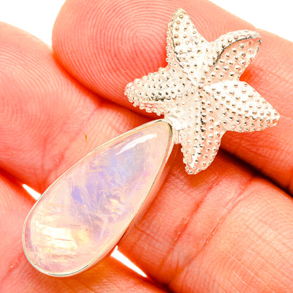 Sterling silver starfish pendant with iridescent opal teardrop cabochon close-up