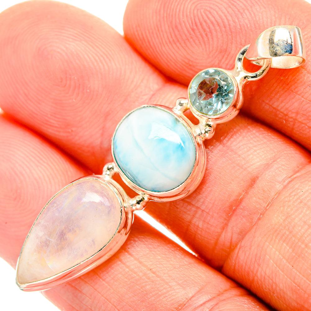 925 sterling silver pendant closeup with blue oval, pale oval, and two round gemstones