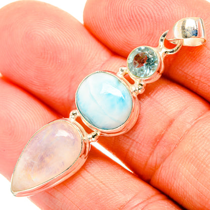 925 sterling silver pendant closeup with blue oval, pale oval, and two round gemstones