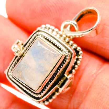 Sterling silver pendant with rectangular opal-like stone and ornate rope bezel bail