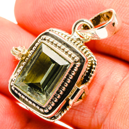 Green amethyst pendant close-up with faceted rectangle stone, beaded sterling silver frame