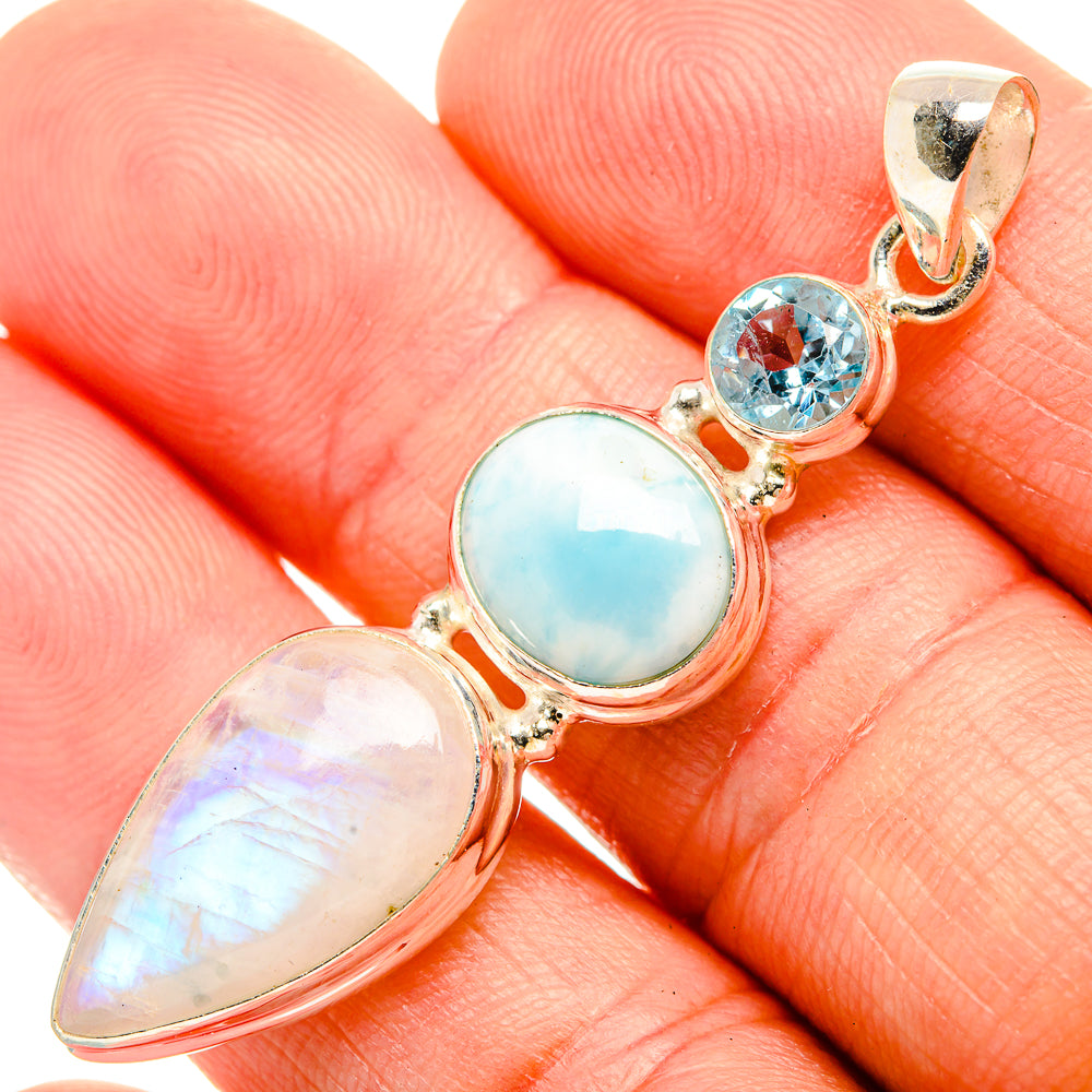 Sterling silver pendant with blue topaz round, larimar oval, and rainbow moonstone drops