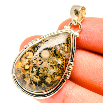 Sterling silver jasper pendant bail and side prongs holding teardrop cabochon