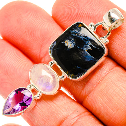 Sterling silver pendant with dark pietersite centerpiece, oval moonstone, and purple pear amethyst