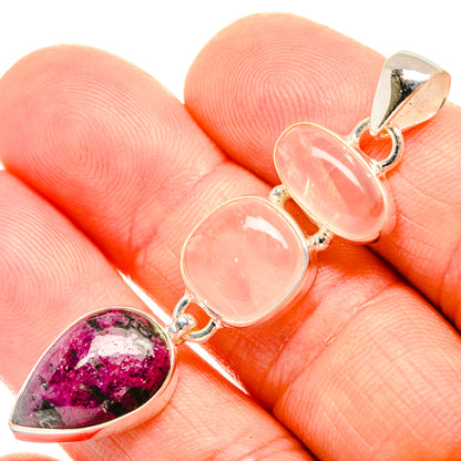 Gemstone pendant with magenta teardrop and two pink oval cabochons in silver setting