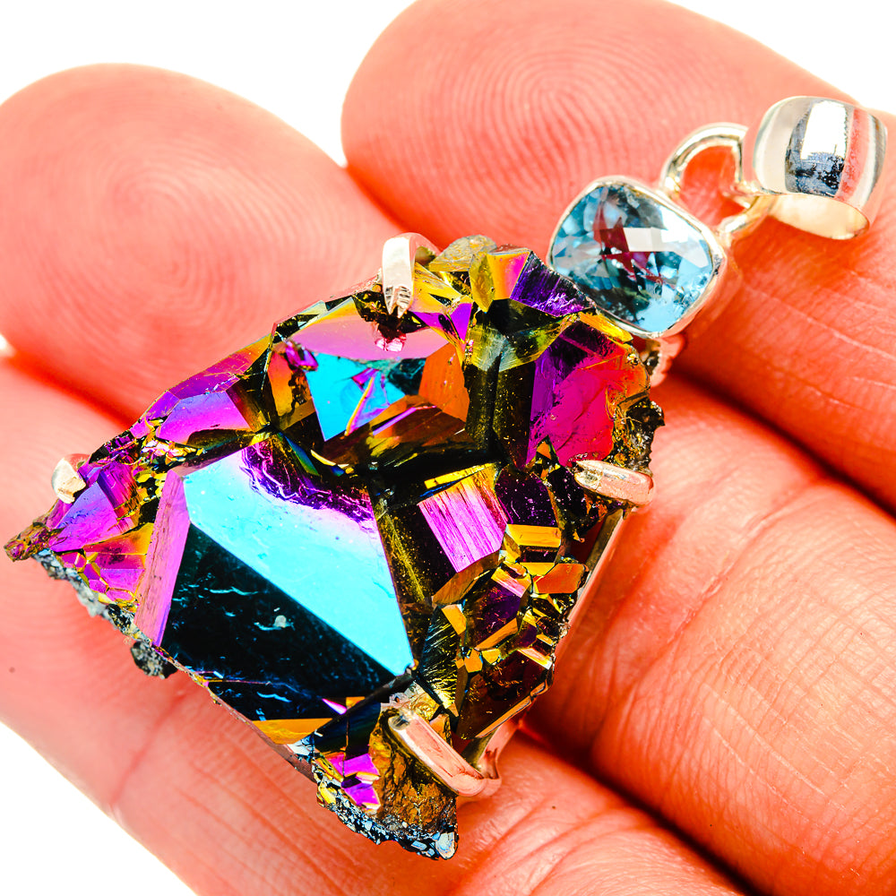 Iridescent rainbow druzy pendant with blue accent stone and 925 silver bail
