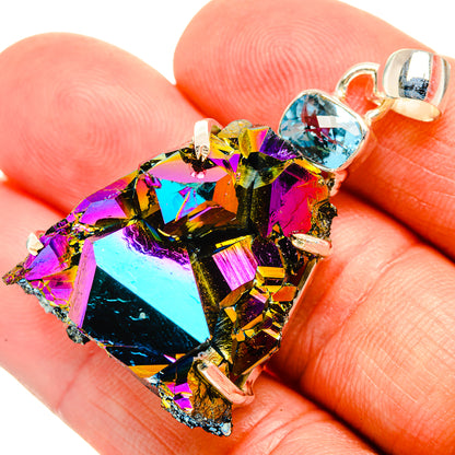Iridescent rainbow druzy pendant with blue accent stone and 925 silver bail