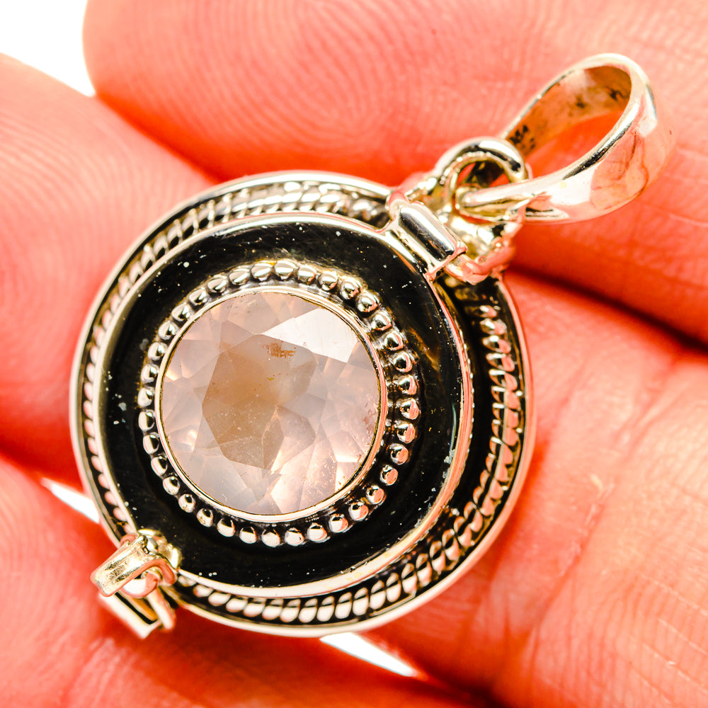 Round rose quartz pendant in black bezel, 925 silver frame with textured edge