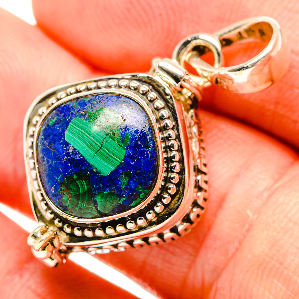 Sterling silver lapis lazuli pendant with oval blue-and-green stone, ornate bezel