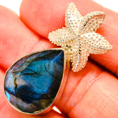 Labradorite pendant close-up: teardrop blue stone with textured bail
