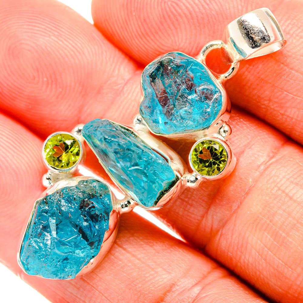 Rough apatite and peridot sterling silver pendant, turquoise stones with green accents