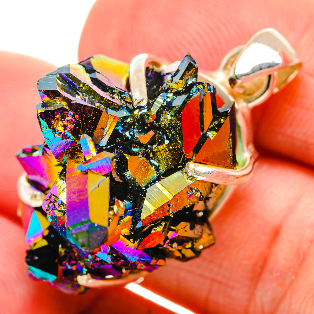Close-up sterling silver druzy pendant with prong-set rainbow crystals and open bail loop