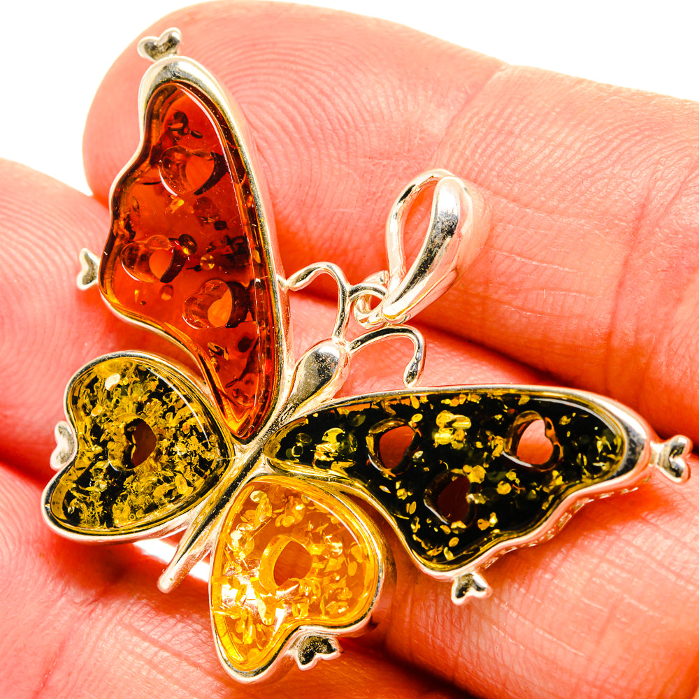 925 sterling silver butterfly pendant with orange, gold amber wings and dark flecks