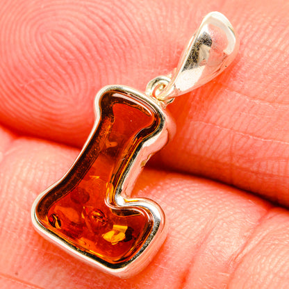 Amber letter L pendant with red-orange Baltic amber in 925 sterling silver setting