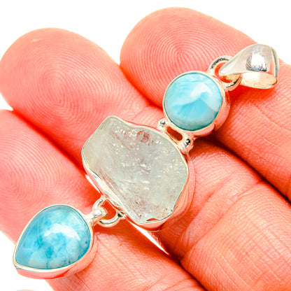 Larimar aquamarine pendant, rough center stone with round blue side stones in silver