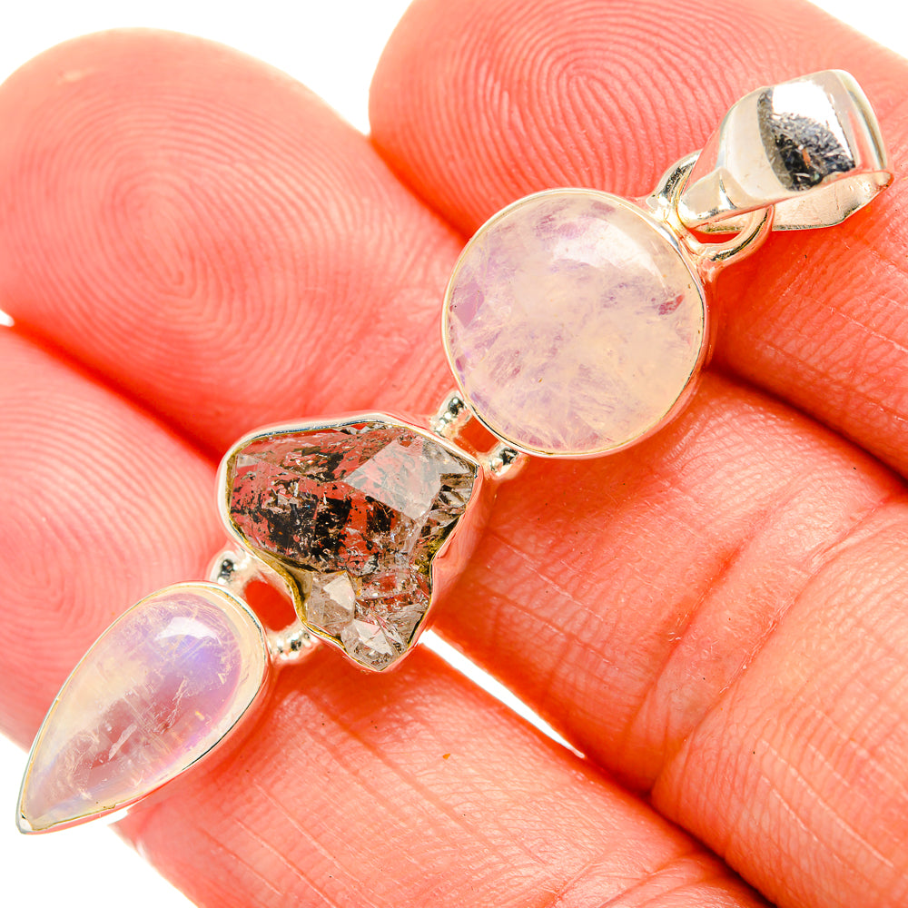 925 sterling silver pendant close-up: round pink moonstone, faceted crystal, pear drop stone