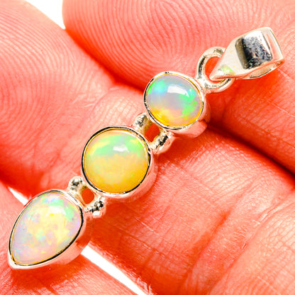 Opal gemstone pendant with four oval cabochons in 925 sterling silver setting