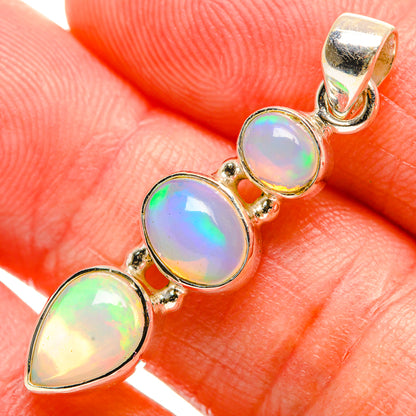 Sterling silver opal pendant with multiple bezel-set oval opal stones and loop bail