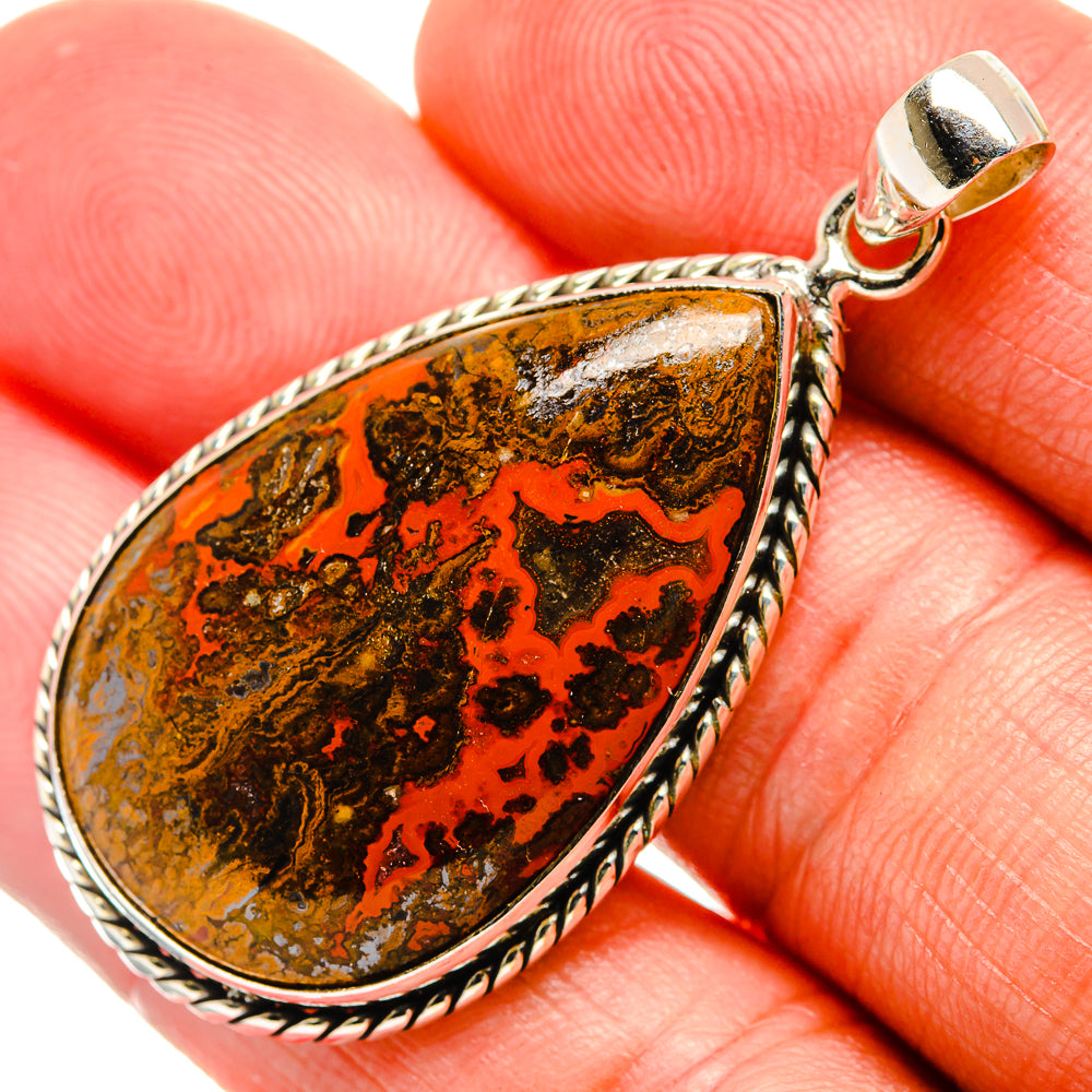 Teardrop agate pendant in orange and brown with silver rope bezel and bail