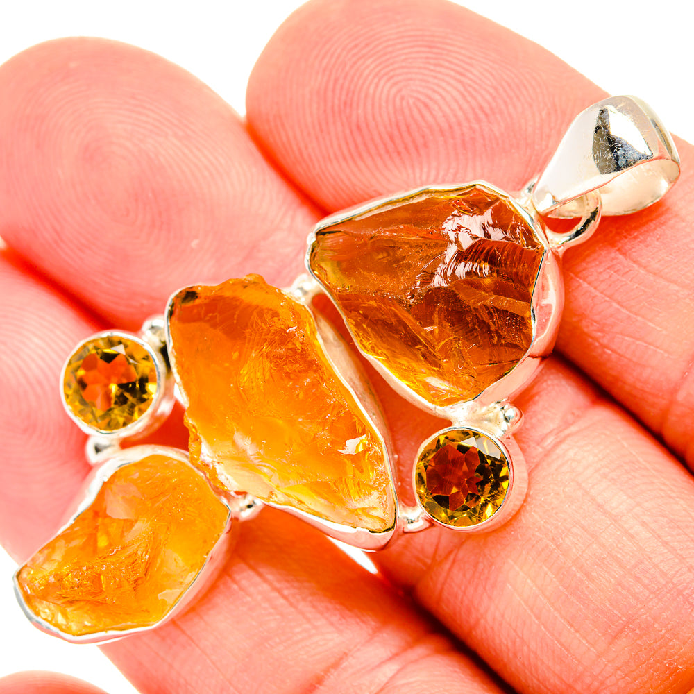 Rough carnelian pendant with three amber stones, two round orange accents, 925 silver