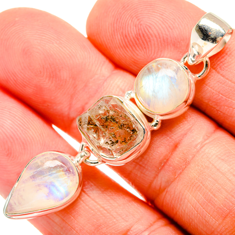 Sterling silver pendant close-up: opalescent rainbow moonstone, herkimer diamond, bail