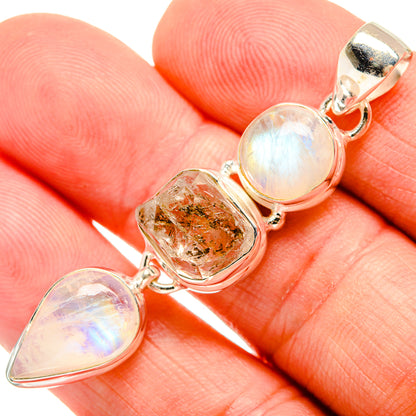 Sterling silver pendant close-up: opalescent rainbow moonstone, herkimer diamond, bail