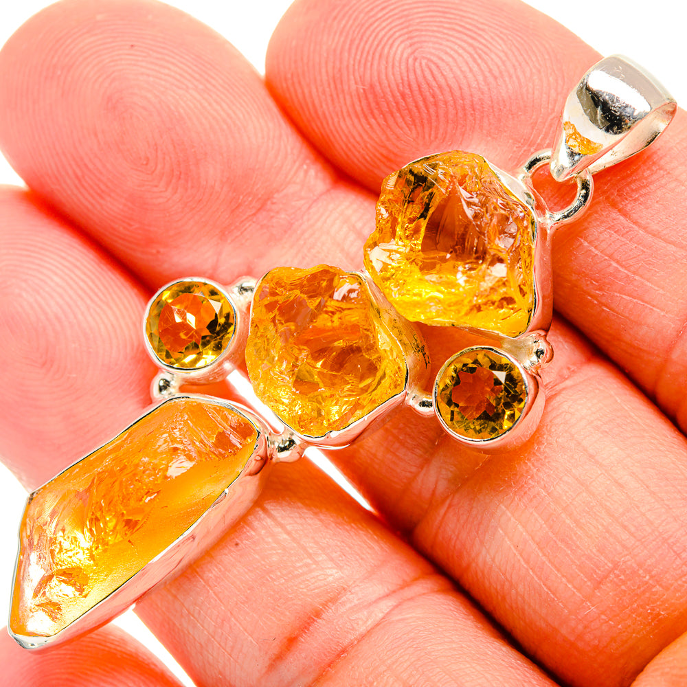 Rough carnelian pendant in 925 sterling silver with orange faceted and round stones