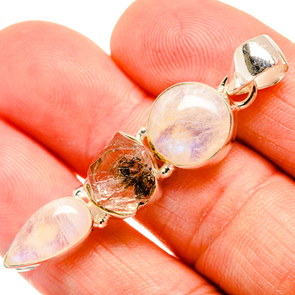 Sterling silver pendant with round opalescent moonstone and raw herkimer diamond