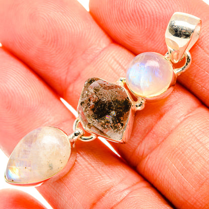 Close-up 925 sterling silver pendant with rainbow moonstone cabochons and crystal