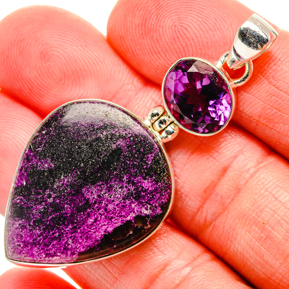 Close-up heart-shaped amethyst pendant, purple gemstone with 925 sterling silver bail