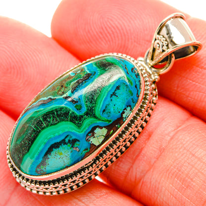 Silver bezel pendant with oval green-blue chrysocolla/malachite stone, teardrop frame