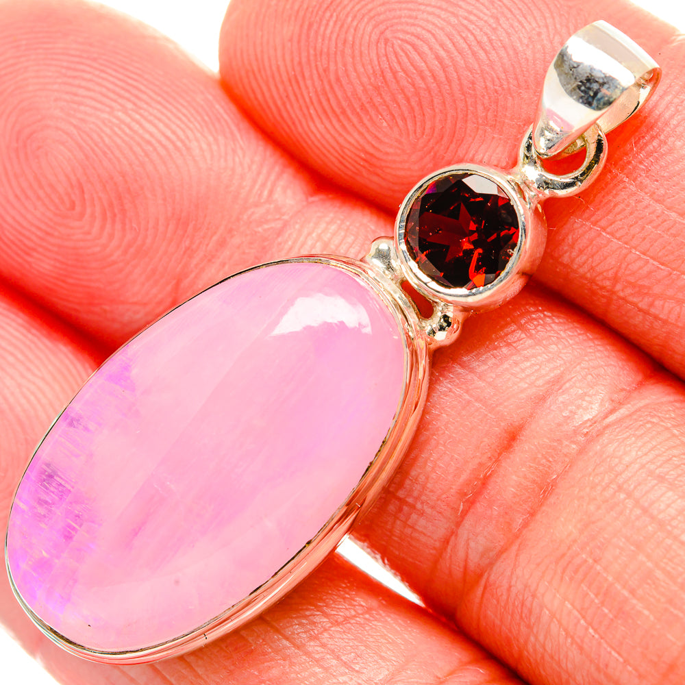 Sterling silver pendant with pink oval moonstone and round garnet accents