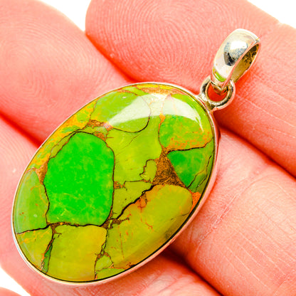 Oval green turquoise pendant with silver bezel and bail, green copper composite stone