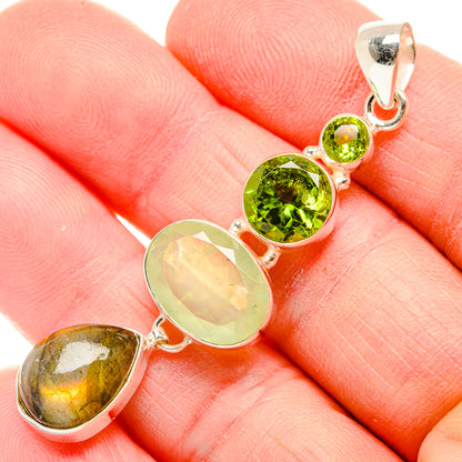 Gemstone pendant on sterling silver bail with green and yellow stones