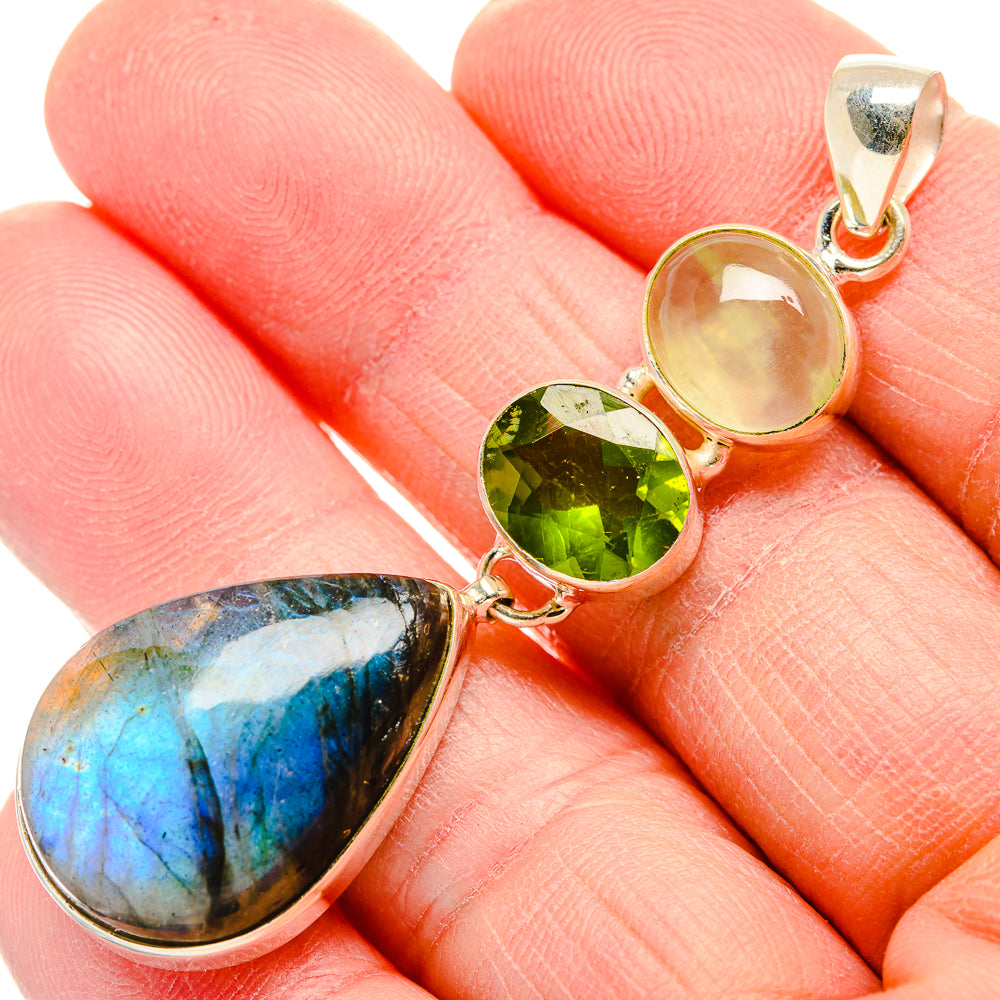 Sterling silver pendant with blue labradorite, green peridot, and pale round stone