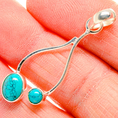 Turquoise howlite pendant with two round stones and sterling silver loops