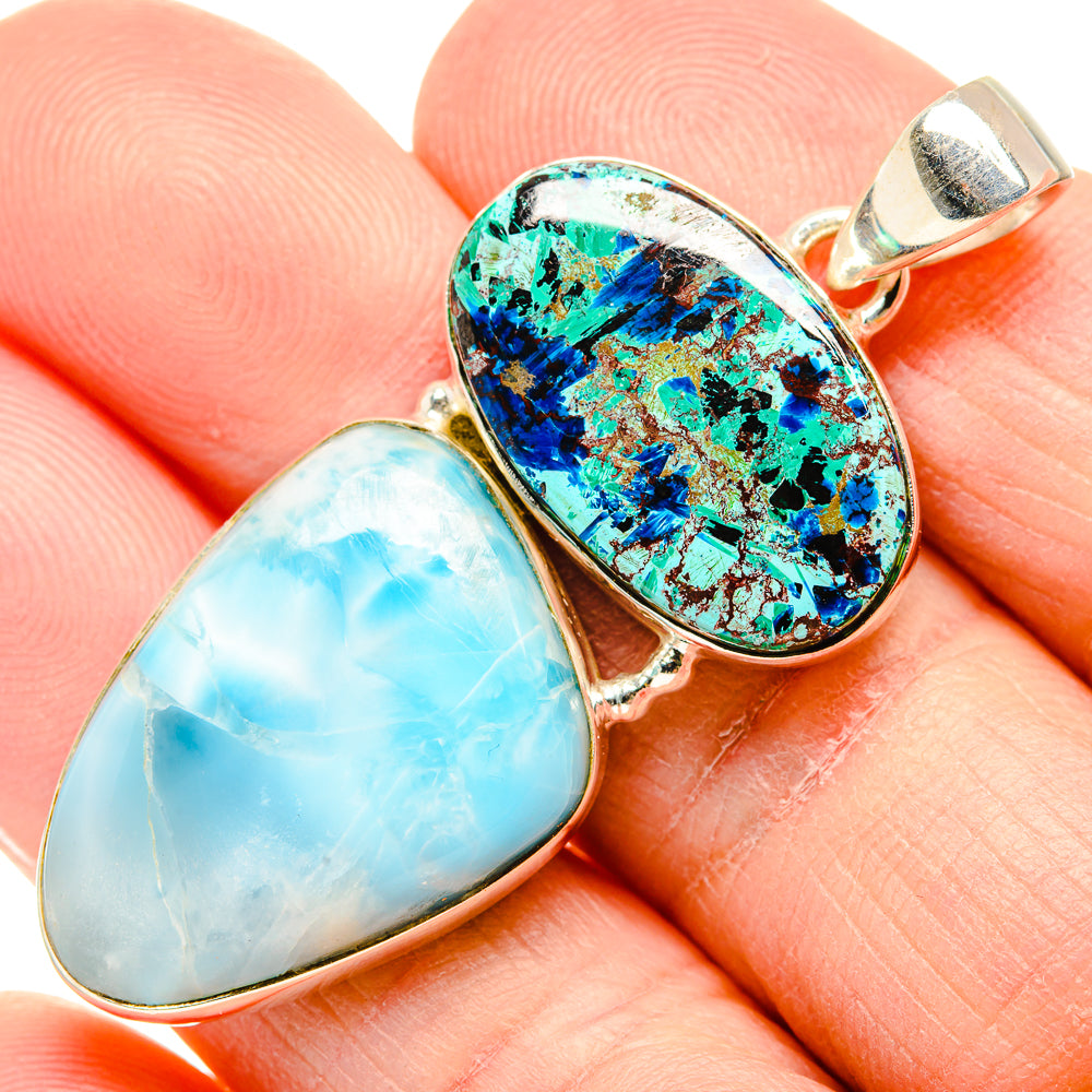 Teardrop pendant close-up: light blue cabochon and blue-green stone in silver setting