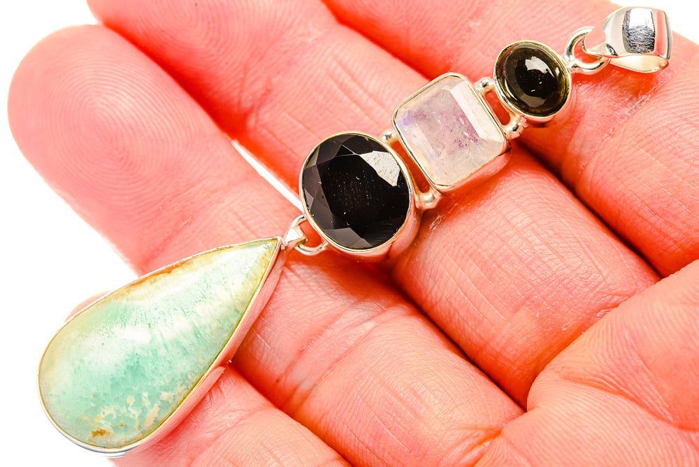 Silver pendant with green opal teardrop, black onyx, pink stone, and rainbow moonstone accents