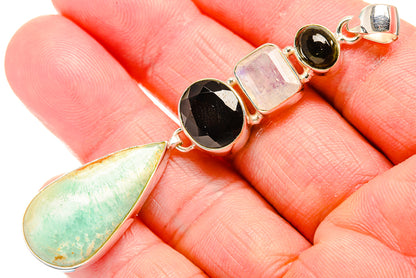 Silver pendant with green opal teardrop, black onyx, pink stone, and rainbow moonstone accents