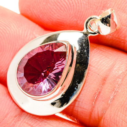 Sterling silver teardrop pendant with magenta faceted stone and blackened border