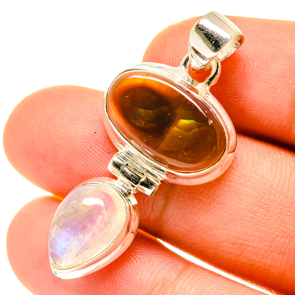 Sterling silver pendant closeup with orange fire agate and light moonstone teardrop