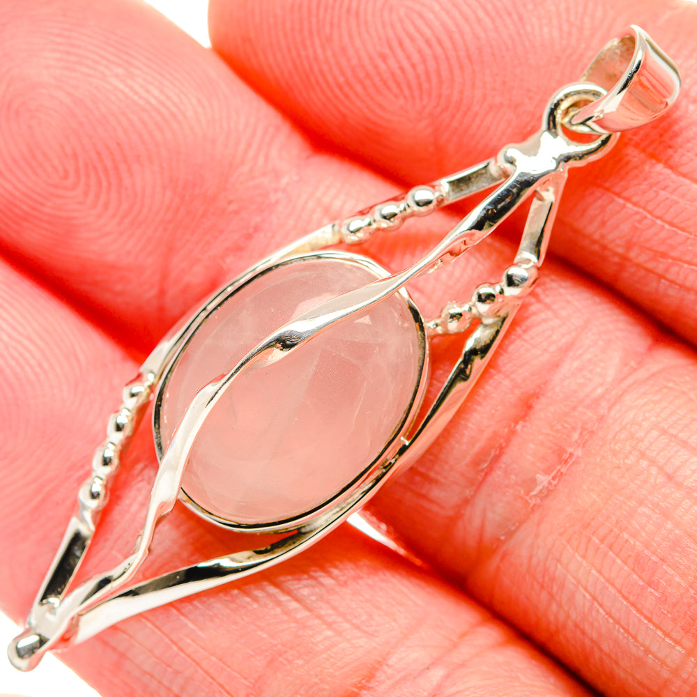 Rose quartz pendant in 925 sterling silver with oval pink cabochon and decorative frame