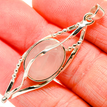 Rose quartz pendant in 925 sterling silver with oval pink cabochon and decorative frame