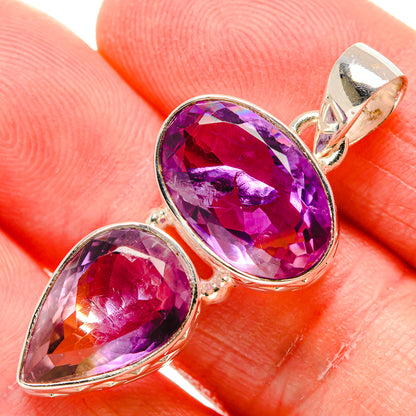 Close-up faceted purple ametrine pendant with oval stones and sterling silver bail