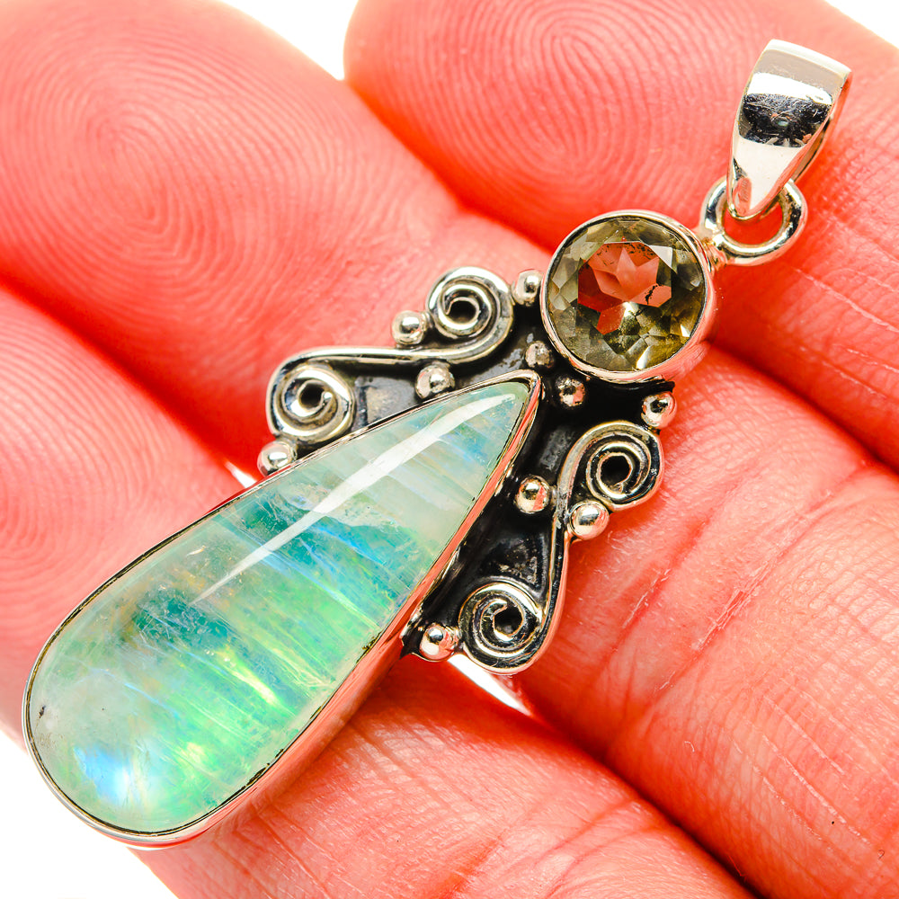 Sterling silver pendant with green opal teardrop and round green crystal, swirl settings